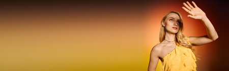 A young woman in trendy attire poses confidently, illuminated by warm, golden hues during twilight.の写真素材