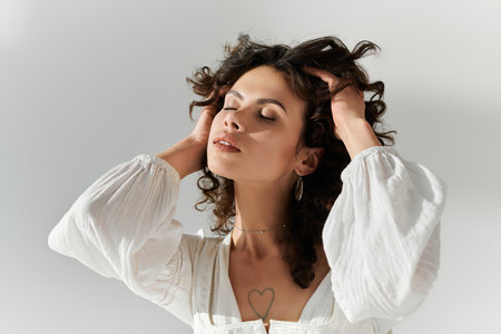 A young beautiful woman styled in fashionable attire gracefully poses with confidence and charm.