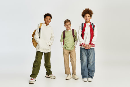 Boys dressed in trendy clothing express their close bond and playful spirit in vibrant colors.