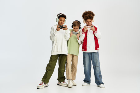 Three young friends dressed in vibrant outfits are deeply engaged in their gaming activity.
