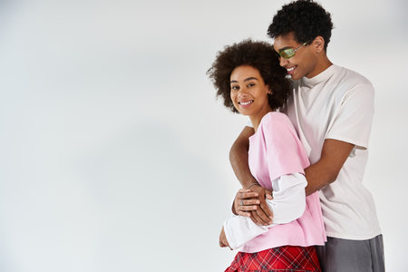 Stylish young couple shares a heartfelt moment, radiating love and aesthetic charm together.の写真素材