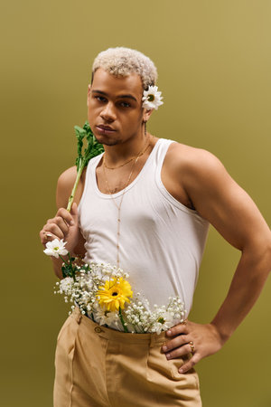 A young and handsome African American man poses confidently in a studio filled with flowers.
