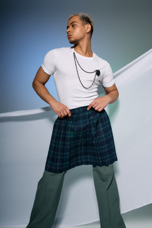 A stylish young man poses confidently in a trendy outfit with dyed hair.