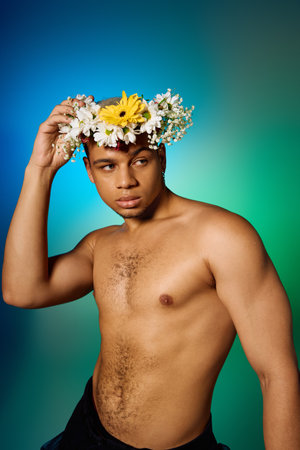 A young African American man with dyed hair poses confidently in a studio, showcasing his beauty.の写真素材