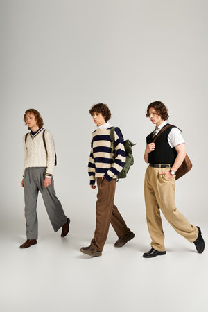 Three young men dressed in fashionable attire stroll together, showcasing their unique styles.