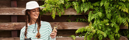 A young beautiful woman relaxes outdoors at a picnic, enjoying nature and her surroundings.の写真素材