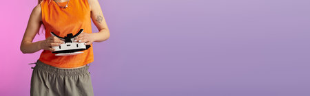 A beautiful young woman radiates joy in a vibrant summer outfit while crafting.の写真素材