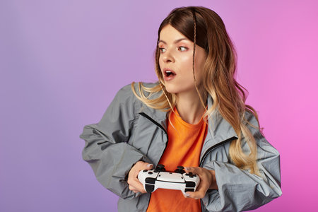 A young woman expresses excitement while gaming, dressed casually in summer attire.