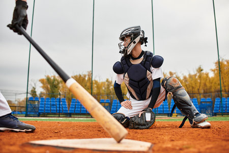 Teenage boys enjoy the thrill of baseball as they practice their skills on a lively field.