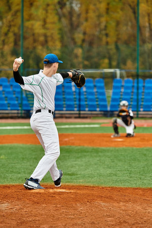 Two teenage boys engage in an exciting baseball match, showcasing their athletic skills.
