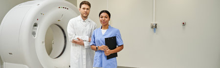 A man and woman in white coats in a contemporary medical facility, banner