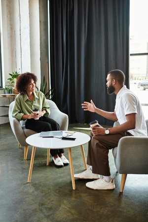 A young woman and man conducting interview in a contemporary studio atmosphere.