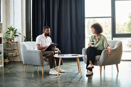 Young professionals conducting interview in a well lit, contemporary studio setting.
