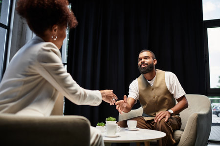 Two young professionals are interacting in a modern studio, showcasing a interview.