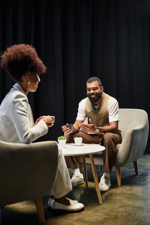 Two young professionals engage in a interview, showcasing their enthusiasm and professionalism.