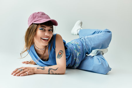 Young woman lounges effortlessly in trendy outfit, showcasing vibrant personality and charm.