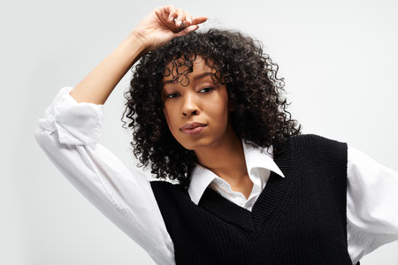 A young woman exudes elegance and confidence with her stylish hair and professional attire.の写真素材