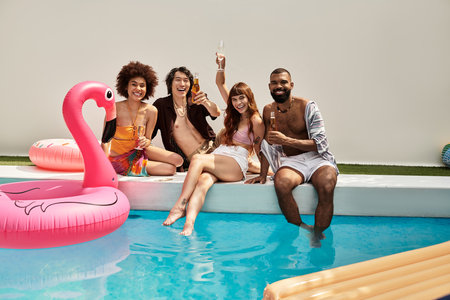 Friends share laughs and refreshing drinks on a fun day at the pool.
