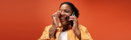 A joyful plus-size Black woman chats on her phone, dressed in trendy autumn fashion, banner