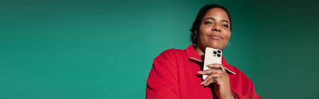 Confident plus-size African American woman in stylish autumn outfit poses with her phone, banner