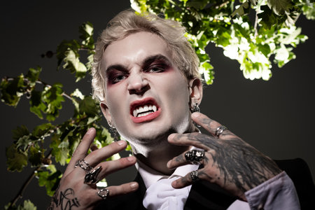 A young man in a striking Halloween costume showcases his edgy style and playful spirit.のeditorial素材