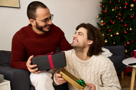 Joyful men exchange gifts, spreading love and happiness in a cozy festive atmosphere at home.