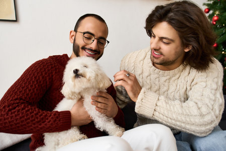 Two men share a warm, loving embrace with their fluffy dog, enjoying the joy of the season together.