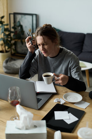A young woman at home deals with feelings of sadness while attempting to manage daily tasks.
