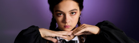 A girl with braids dressed in a gothic Wednesday outfit captures the Halloween spirit perfectly, bannerの写真素材