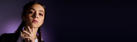 A girl with braided hair wears a Gothic dress inspired by Wednesday, embracing Halloween vibes, bannerの写真素材