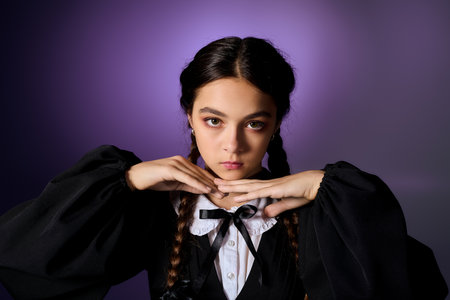 A girl with braids wears a gothic dress, embodying a Wednesday character during autumn festivities.の写真素材