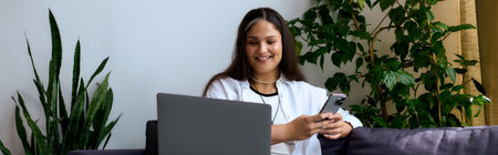 Woman with Waardenburg syndrome enjoys remote work while connecting through her phone, banner