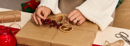 Festively wrapping a gift with natural decorations and joyful holiday energy in a warm atmosphere.
