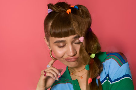 Young woman poses confidently, showcasing her unique fashion sense with colorful hair accessories.