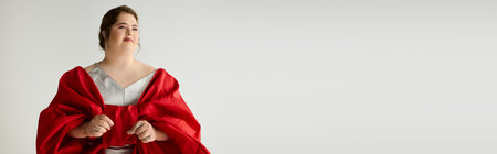 A young woman with Down syndrome radiates joy in her bright, flowing outfit.の写真素材