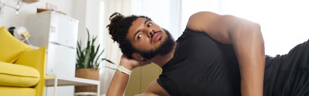 Athletic man exercising at home, focusing on fitness while showcasing diversity and strength, banner