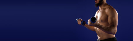 A man with a beard exercises with dumbbells, showcasing his athletic physique.の写真素材