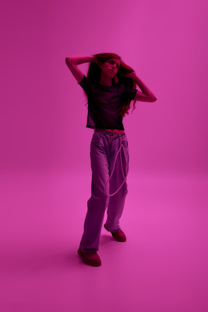 A colorful scene where a person joyfully celebrates pride through fashion and expression.の写真素材