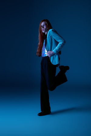 A person shows pride and individuality with colorful clothing and expressive poses.の写真素材