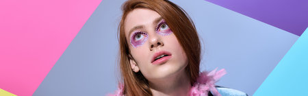 A person showcasing colorful makeup and vibrant fashion stands against a geometric backdrop.
