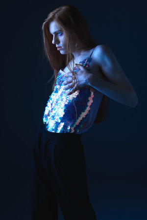 A proud person displays unique style in a vibrant outfit, radiating confidence.の写真素材