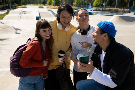 Four friends gather to enjoy each others company and share fun moments in the park