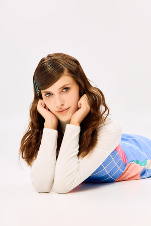 A beautiful woman lies gracefully, displaying cheerful and colorful attire, embodying fashion art.