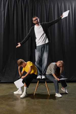 A stylish tutor inspires kids in drama, fostering laughter and creativity in their performances.