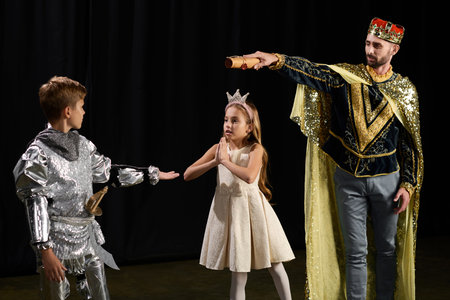 Stylish man teaches young kids the art of theater through an imaginative performance scene.