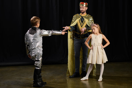 Stylish male tutor enthusiastically teaches children the joys of theater during an exciting lesson.