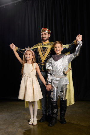 Charming male teacher engages kids in theater, nurturing their imagination and creativity together.の写真素材