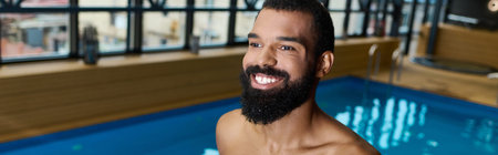 An African American man with a beard enjoys a tranquil moment in a spa while relaxing, bannerの写真素材