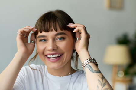 Young woman with bangs enjoys her cozy apartment, radiating joy and style in casual wear.