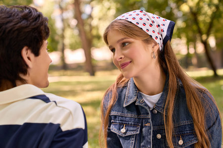 Young lovers share a joyful date in a beautiful autumn park, surrounded by trees